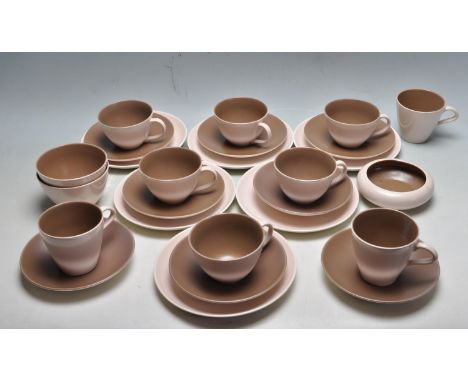 A retro vintage 1970s Poole Pottery two tone tea service comprising of cups, saucers ashtrays and sideplates. The tea service