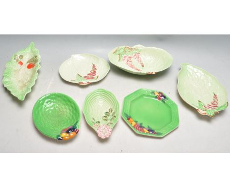 A collection of five early 20th century 1930 ceramic Carlton Ware green leaf plates together with two other similar plates. M