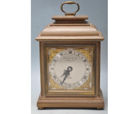 A 20th Century Elliot mantel clock retailed by Garrard &amp; Co Ltd Regent Street London, having a silvered face with roman n
