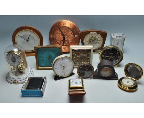 A collection of 1960s retro mid century clocks to include a Hermle skeleton clock, a Metamec carriage clock, two travel alarm