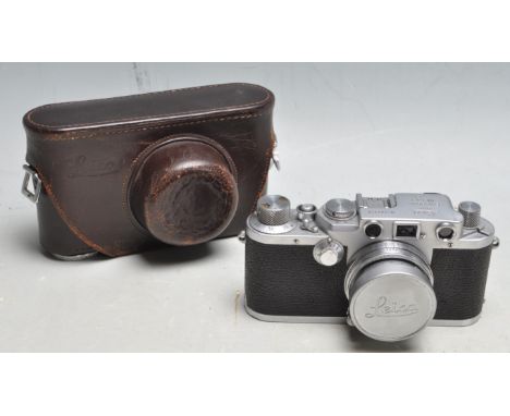 A vintage Leica D.R.P. Ernst Leitz Wetzlar 35mm camera, serial No. 584318 and f=5cm 1:2 lens with serial No: 864378 complete 