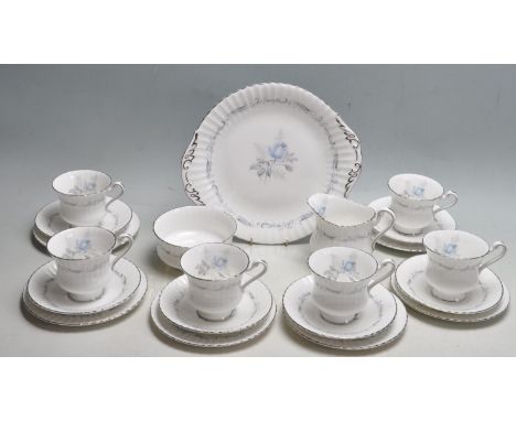 A vintage Paragon bone china Staffordshire “ Morning Rose “ tea service comprising of six cups, saucers, cake plates, sugar b