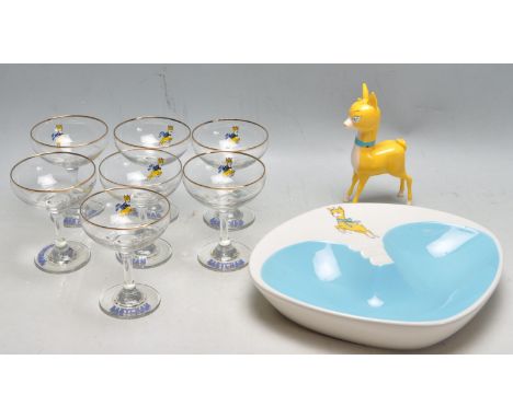 A collection of seven retro vintage 20th century advertising Babycham glasses / cocktail glasses of typical form together wit