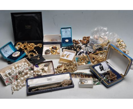 A collection of vintage costume jewellery to include a Sardi flamingo brooch, wide selection of beaded necklaces, mid Century