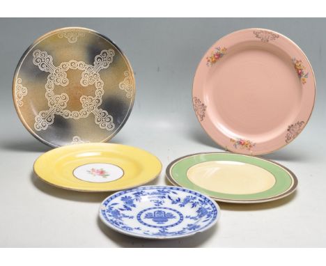 A selection of 20th century plate / dinner plates and cabinet plates to include a Clarice Cliff pink plates, Spode, Minton, D