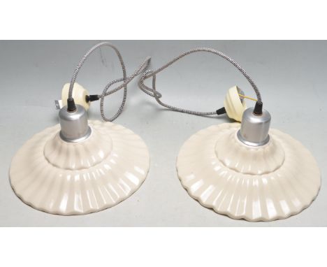 A pair of retro vintage late 20th century Italian ceramic light shades having a chrome cap &amp; bakelite socket set within a