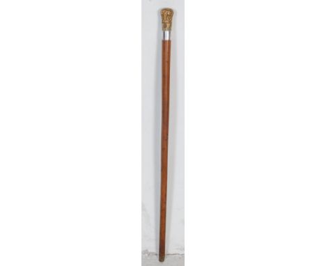 A 20th century antique walking stick, having a bone knob handle with metal dot work decoration, a silver collar hallmarked fo