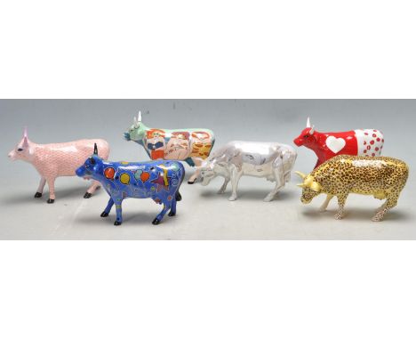 A collection of six retro vintage Cow Parade ceramic cow figurines comprising of a leopard print cow, a cow with Beryl Cook s