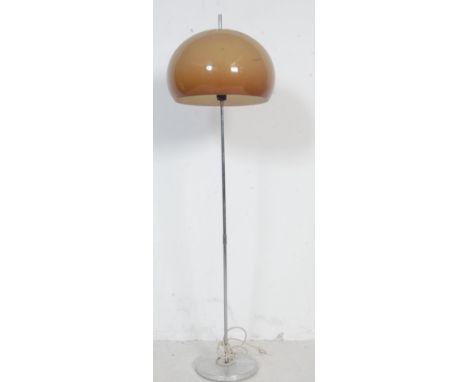 A retro vintage 1970s floor lamp in the manner of Harvey Guzzini. The lamp having an acrylic globe shaped shade in olive gree