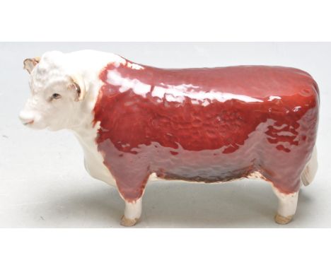 Beswick - A late 20th century vintage bone china ceramic polychrome bull - Champion of Champions. Printed marks to the base. 