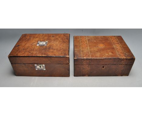 A 19th century Victorian wooden writing slope box having inlaid marquetry to the top. together with a walnut tea caddy of rec