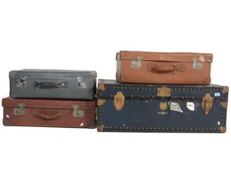 A collection of four  vintage retro 1930’s and later suitcases and travel trunks to include brown leather suitcases, large bl