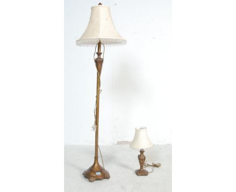 A Victorian style floor / standard lamp with gilded finish and of classical form&nbsp; together with a matching table lamp co