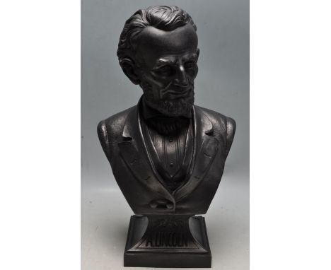 A vintage late 20th century black cast metal bust of US President Abraham Lincoln. Name stamp to the base. Measures 42cm high