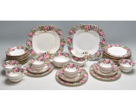 A vintage late 20th century Aynsley tea service comprising of cups, saucers, cake plates, sugar bowls, creamer jugs and more.