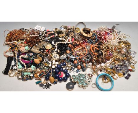 A large quantity of vintage late 20th century costume jewellery comprising of necklaces, ring, earrings, brooches and more.&n