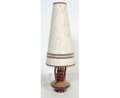 A vintage retro West German fat lava lamp base of bulbous form with twin handles and needlework shape.Measures, 91 cm H x 24 