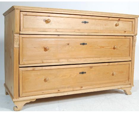 A large vintage late 20th century chest of drawers having a flared top over a bank of three spacious drawers with knob handle