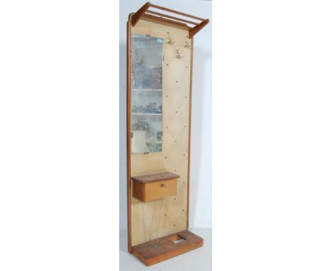 A retro vintage 1960s hall stand of narrow proportions with a slatted hat rack above a vinyl studded back with three chrome c