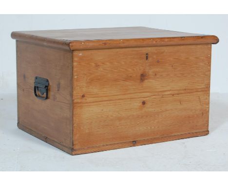 A vintage mid 20th century pine box / chest having a flared top opening to reveal a spacious interior with carry handles to t
