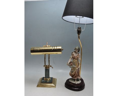 A vintage retro brass bankers lamp having a square brass base with faux marble column and a cylindical shades raised on doubl