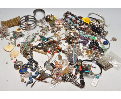 A collection of late 20th century vintage costume jewellery comprising of brooches, necklaces, earrings, bracelets, bangles a