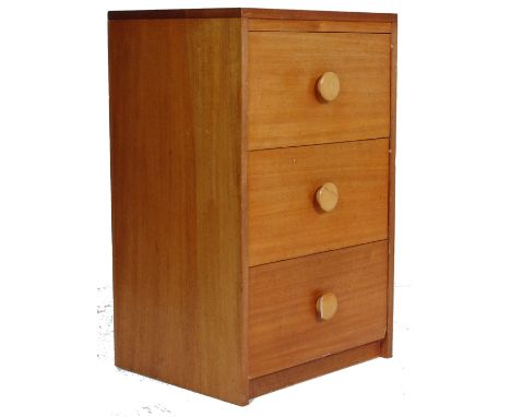 A vintage late 20th century teak wood veneer chest of drawers / bedside cabinet. The cabinet having three drawers with raised