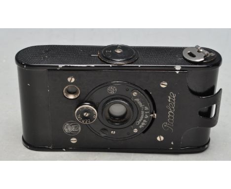 A vintage 1920's Contessa - Nettel Piccolette rollefilm pocket camera with bellows operation complete with original fitted ca
