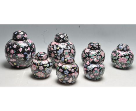 A collection of seven early 20th century and later Chinese oriental Famille Noire Ginger jar / lidded ceramic ginger jars of 