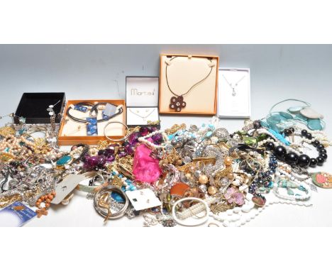 A large quantity of vintage late 20th century costume jewellery comprising of necklaces, ring, earrings, brooches and more.&n