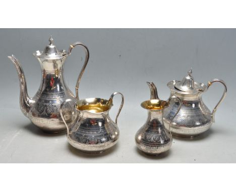 A 19th Century Victorian Joseph Angell II silver hallmarked tea set consisting of tea pot, hot water pot, sugar bowl and crea