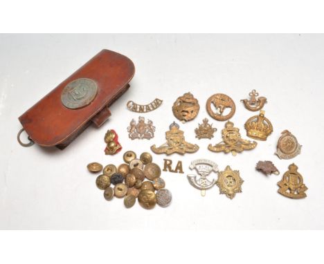 A collection of British military badges dating from the first world war WWI and the second world war WWII to include a Tank C