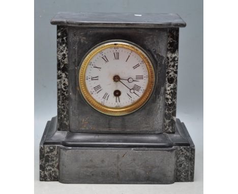 An antique Victorian 19th century black slate and marble mantel clock. The clock dial being white enamelled with black&nbsp;R