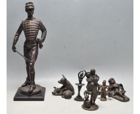 A collection of vintage 20th century brass and cast metal figures to include a large WWI general / soldier, small pig figurin