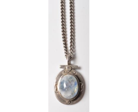 A vintage 20th century moonstone / labradorite pendant with a heavy silver mount &amp; and chain together with a pair of moon