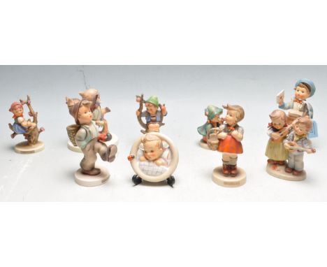 A collection of nine 20th century ceramic&nbsp;German Hummel (W. Germany ) figurines of children doing various activities to 