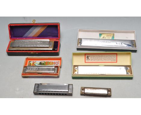 A collection of five German mid century and later Harmonica musical instruments to include makers as M. Hohner - Vest Pocket 