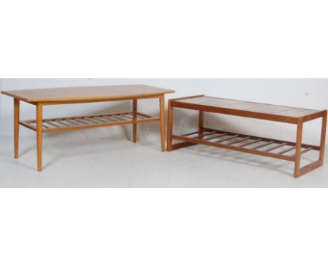 Two retro vintage 1970s teak wood coffee tables. One table having a rectangular shaped top with slatted undertray raised on c