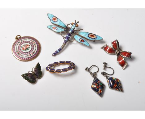 A collection of antique early 20th century Edwardian enamels comprising of an Art Deco style butterfly brooch, a pir of earri