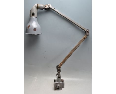 A retro vintage industrial factory Mek Elek triple jointed anglepoise lamp having a bracket fixing and conical metal light sh