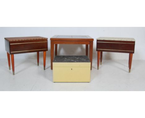 A group of three vintage 20th century sewing boxes / metamorphic sewing box’s having hinged lids with fitted interiors along 