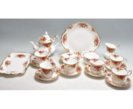 A vintage mid 20th century Royal Albert Old Country Roses fine bone china tea service to include a teapot, cups, saucers, cre