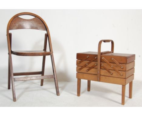 A vintage mid century oak frame folding chair with panel backrest, arched top, raised on square legs together with a metamorp