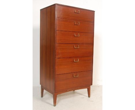 LEBUS - A retro vintage 1970s teak wood chest of drawers of upright form having a bank of six drawers with brass handles rais