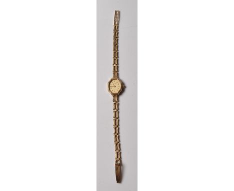 A ladies 9ct gold Avia Quartz cocktail watch having a fancy link bracelet chain with a gilt face and baton markers to the cha