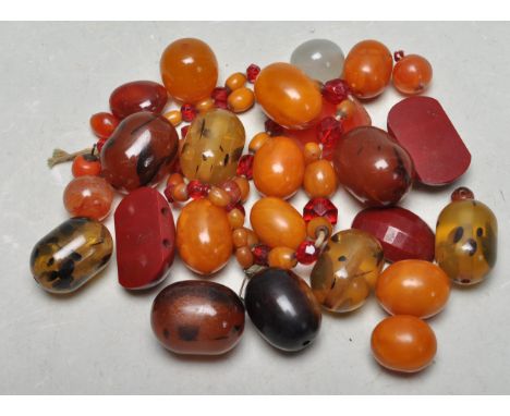 A collection of various vintage beads to include amber, faux tortoise shell, and vintage / early plastic beads of various col
