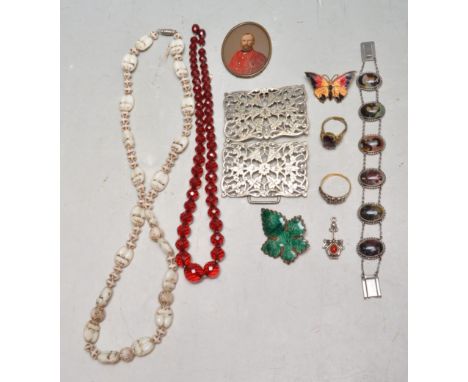 A collection of antique and later jewellery items to include an early 20th century enamel butterfly brooch, a red faceted ' c