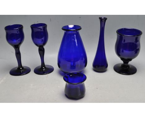 A collection of late 20th century vintage Bristol Blue glassware comprising of a goblet / chalice, trinket pot, vase, wine gl