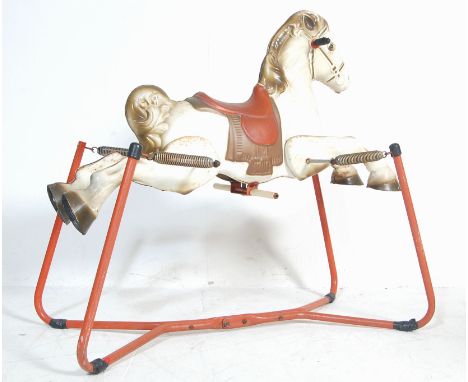 A vintage retro 1960's Mobo ' Prarie King ' ride on&nbsp; rocking horse having a white and brown painted body raised on a red