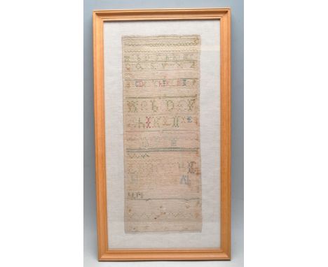 An early 19th century Georgian / Victorian framed needlepoint sampler with alphabet lettering and patterned stitching. Framed